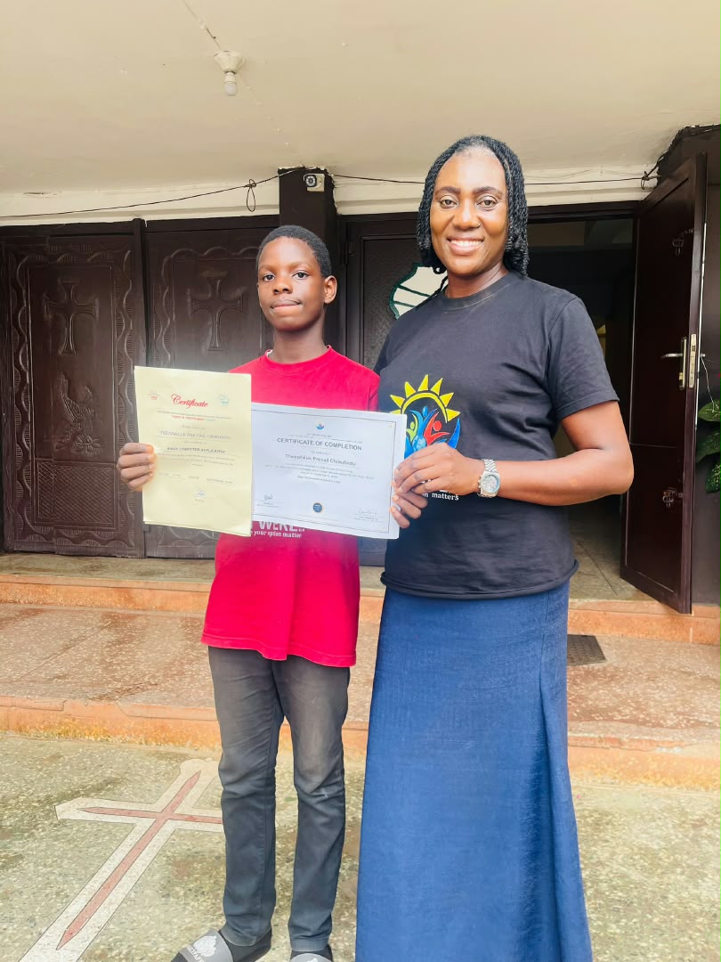 Theophilus Prevail receiving his certificates alongside Charity Ani