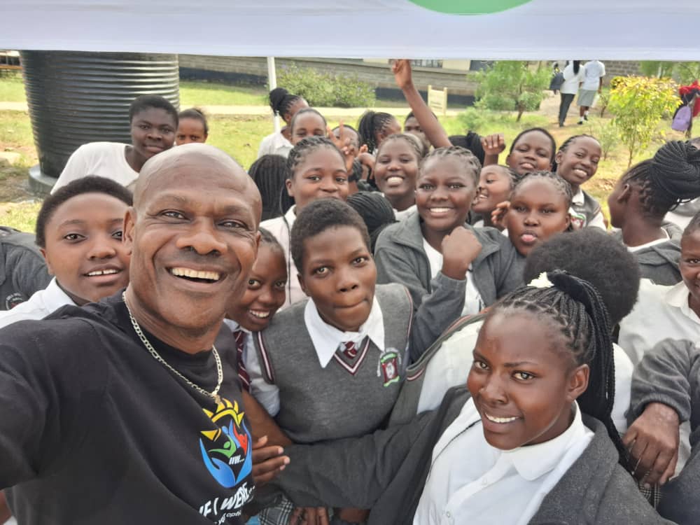 Engr. Cornelius Ani with the If I Were XYZ Kenya team and scholarship recipients after the Embakasi event